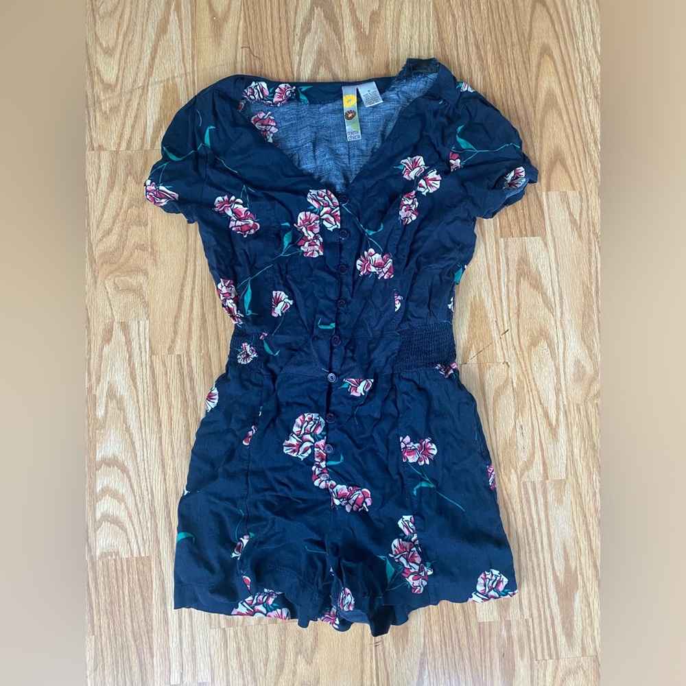 Navy blue and pink floral romper with elastic waist and button front